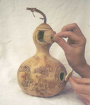 Fairy House
Sept. 2001
Some of Lyx's best gourd work, and a good shot of her hands as well!